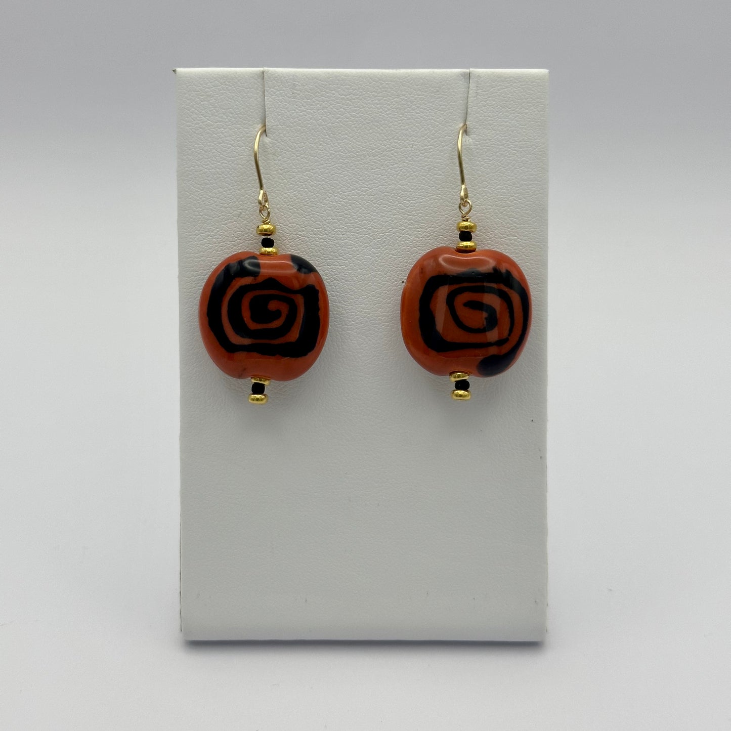 Kenyan Clay Bead Earrings: burnt orange and black spirals